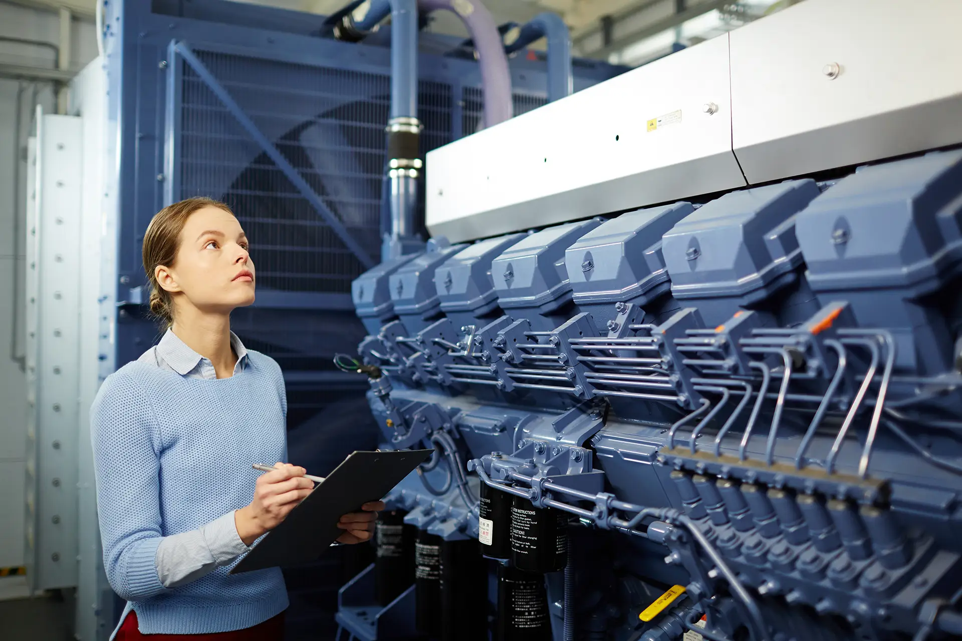 Woman Inspecting Generator