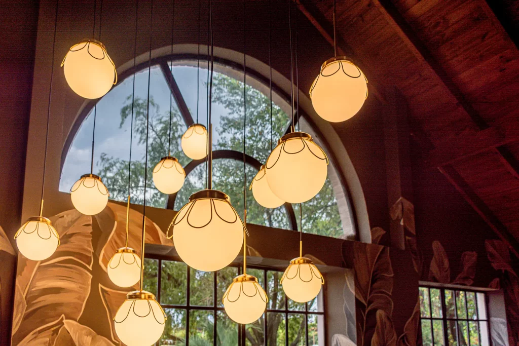 round pendant lights hanging from a high ceiling